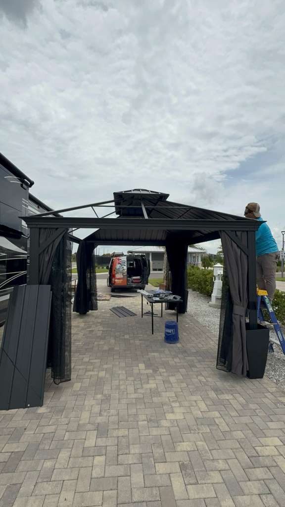 Bayside Home Pros crew assembling a hardtop gazebo