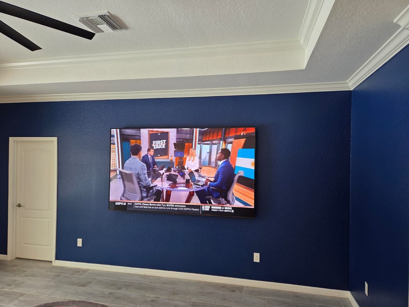 Large TV mounted on accent wall